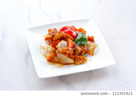 Healthy Chinese sweet and sour pork with plenty of vegetables such as onions, carrots, and green peppers. Healthy Chinese sweet and sour pork with plenty of vegetables such as onions, carrots, and green peppers. 123391821