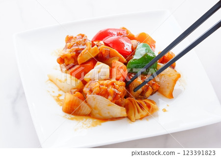 Healthy Chinese sweet and sour pork with plenty of vegetables such as onions, carrots, and green peppers. Healthy Chinese sweet and sour pork with plenty of vegetables such as onions, carrots, and green peppers. 123391823