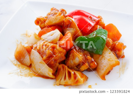 Healthy Chinese sweet and sour pork with plenty of vegetables such as onions, carrots, and green peppers. Healthy Chinese sweet and sour pork with plenty of vegetables such as onions, carrots, and green peppers. 123391824