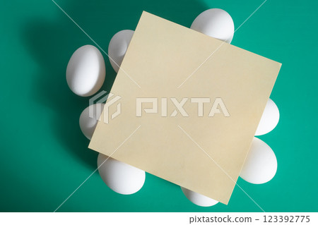 Happy easter. Blank paper card in Easter egg on vibrant green background. Happy easter. Blank paper card in Easter egg on vibrant green background. 123392775