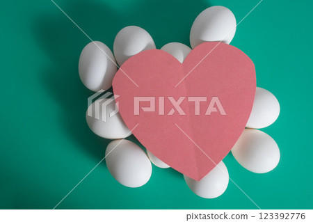 Happy easter greeting card, Easter love, white egg with red paper heart on green background. Happy easter greeting card, Easter love, white egg with red paper heart on green background. 123392776