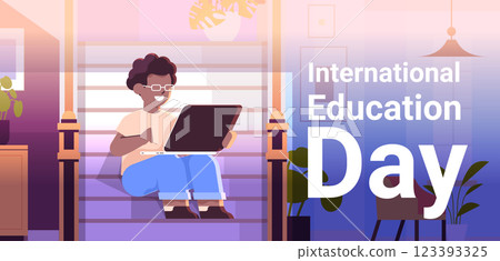 student watching free online courses on laptop international education day live webinar e-learning concept living room interior 123393325