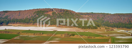 Wintry landscape with snow-covered fields and hills. Wintry landscape with snow-covered fields and hills. 123393790