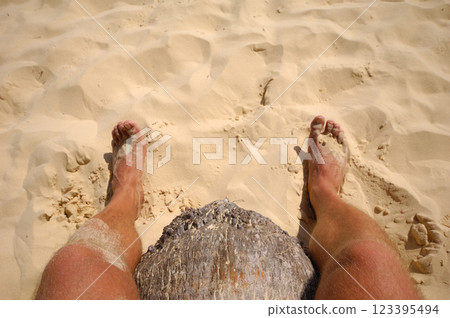 Feet in the sand 123395494