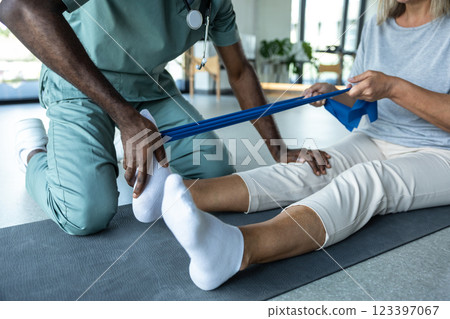 African american physical therapist working with a female patient 123397067