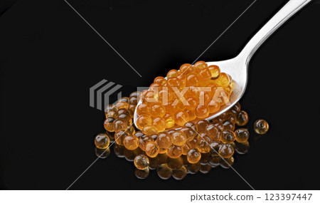 Spoon of red caviar, package design element close-up, full depth of field, macro Spoon of red caviar, package design element close-up, full depth of field, macro 123397447