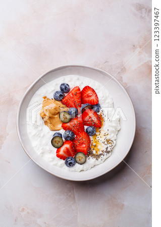 Cottage cheese with berries, peanut butter and honey. Cottage cheese with berries, peanut butter and honey. 123397467