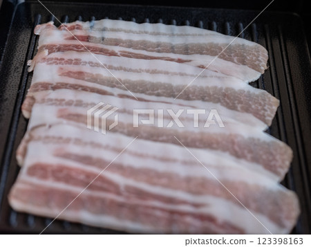 Sliced belly pork for shabu or Japanese hot pot on black tray 123398163