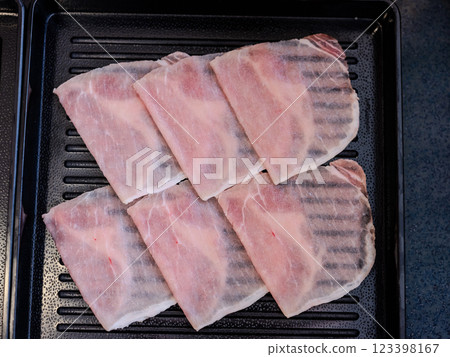 Sliced belly pork for shabu or Japanese hot pot on black tray 123398167