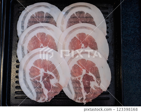 Sliced belly pork for shabu or Japanese hot pot on black tray 123398168
