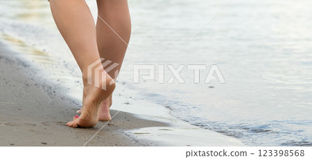 Beach travel - woman walking Beach travel - woman walking 123398568