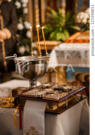 Religious Ceremony Setting with Lit Candles and Holy Texts Religious Ceremony Setting with Lit Candles and Holy Texts 123398651