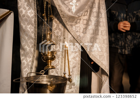 Spiritual Ceremony with Incense and Candle in Religious Setting Spiritual Ceremony with Incense and Candle in Religious Setting 123398652