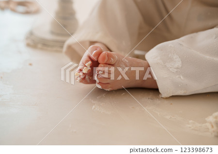 Sweet Exploration: A Baby s Chubby Feet Covered in Flour and Mess 123398673