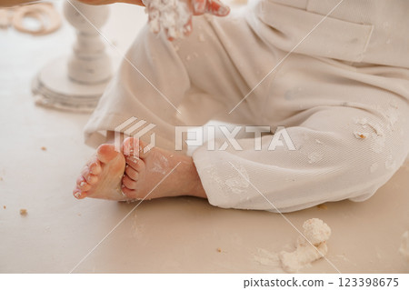 Tiny Toes and Floury Playtime: A Delightful Mess of Childhood 123398675