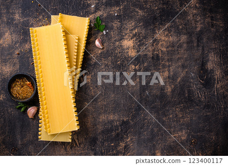 Uncooked lasagna pasta with cooking ingredient 123400117