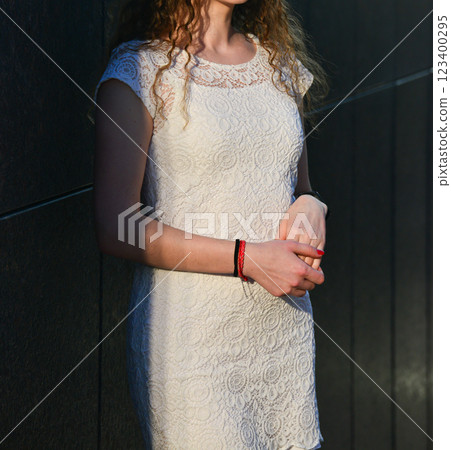 Young Woman in White Dress Posing at Sunset Young Woman in White Dress Posing at Sunset 123400295