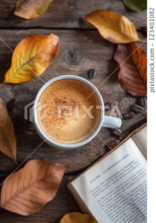 Cup of coffee with an open book and autumn with fallen leaves on a wooden background, seasonal lyrical atmosphere. Cup of coffee with an open book and autumn with fallen leaves on a wooden background, seasonal lyrical atmosphere. 123401082