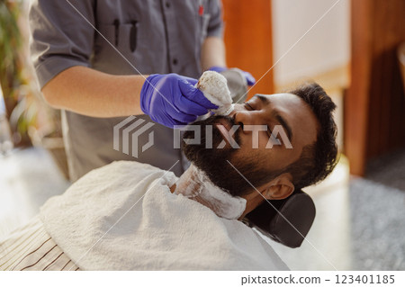 Enjoy a deeply relaxing barber experience that includes a rejuvenating beard treatment Enjoy a deeply relaxing barber experience that includes a rejuvenating beard treatment 123401185