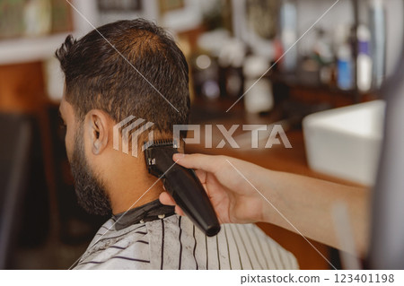 Professional Barbering Experience a Unique Haircut in a Chic, Modern Barbershop Environment Professional Barbering Experience a Unique Haircut in a Chic, Modern Barbershop Environment 123401198