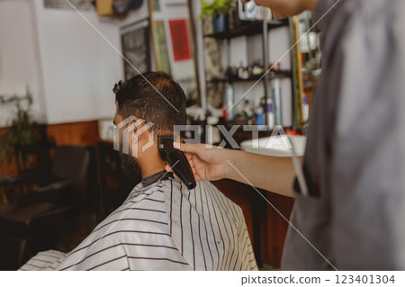 Experience a Stylish Haircut at a Modern Barbershop for a Truly Unique Atmosphere 123401304
