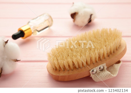 Set of home SPA cosmetic products. Dry Brush and Organic Oil. Anti-cellulite brush for dry body massage. 123402134