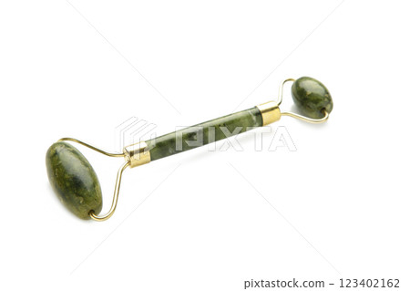 Green face roller isolated on white background 123402162