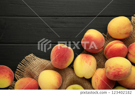 Fresh ripe peaches on black background, top view 123402182