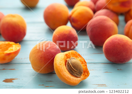 Fresh apricots on a old blue background. Space for text Fresh apricots on a old blue background. Space for text 123402212