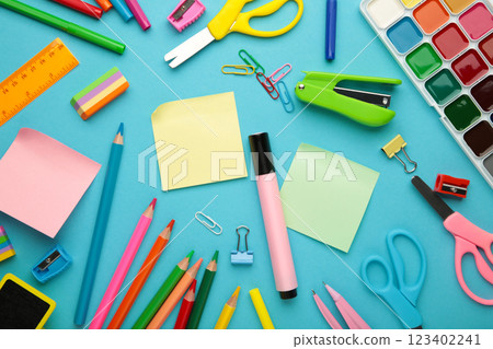 Different stationery on blue background, flat lay with space for text. Back to school 123402241