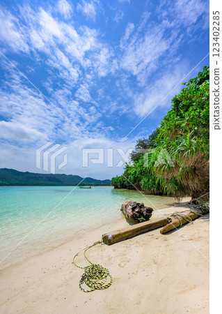 Kabira Bay beach with white sand and blue sky White sand and blue sky Kabira Bay beach with white sand and blue sky White sand and blue sky 123402285