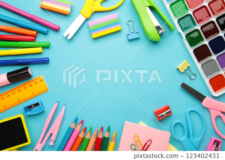 Different stationery on blue background, flat lay with space for text. Back to school 123402431