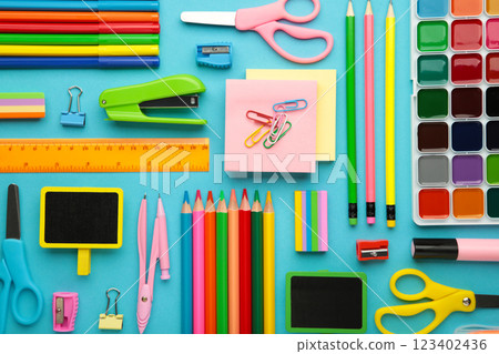 School supplies on blue background. Back to school concept. School supplies on blue background. Back to school concept. 123402436