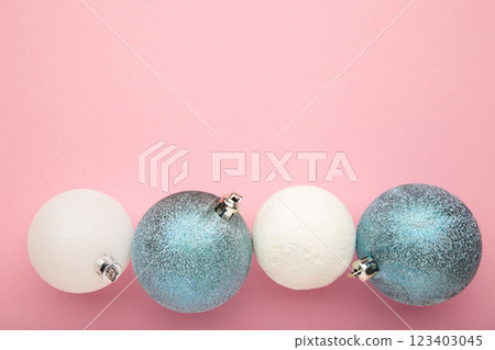 Christmas composition. Christmas blue and white balls on pink background. Christmas composition. Christmas blue and white balls on pink background. 123403045