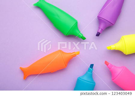 Colored markers for highlighting text on purple background. Colored markers for highlighting text on purple background. 123403049