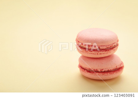 Sweet raspberries macarons on beige background. Space for text Sweet raspberries macarons on beige background. Space for text 123403091