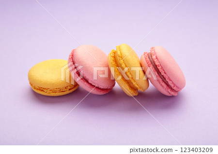 French colorful macarons on purple background French colorful macarons on purple background 123403209
