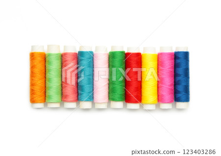 Color sewing threads isolated on white background. 123403286