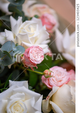 A Stunning Arrangement Featuring a Beautiful Bouquet of Pink and White Roses Alongside Lilies A Stunning Arrangement Featuring a Beautiful Bouquet of Pink and White Roses Alongside Lilies 123403425