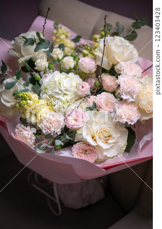 A Stunning Arrangement Featuring a Beautiful Bouquet of Pink and White Roses Alongside Lilies A Stunning Arrangement Featuring a Beautiful Bouquet of Pink and White Roses Alongside Lilies 123403428