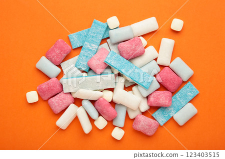 Different chewing gums on orange background. Different chewing gums on orange background. 123403515