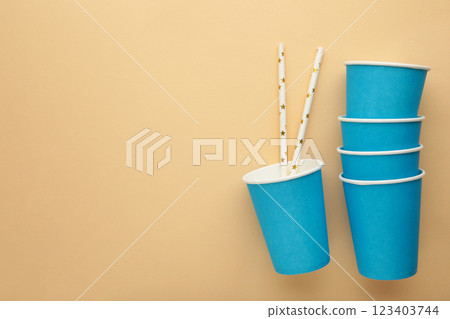 Paper disposable cup on beige background. 123403744