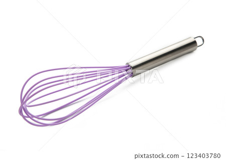 Purple silicone whisk on a white isolated background. Top view. Purple silicone whisk on a white isolated background. Top view. 123403780
