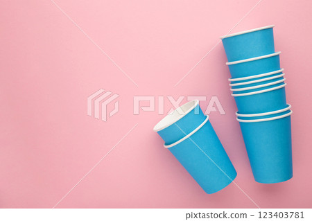 Paper blue disposable cup on pink background. Paper blue disposable cup on pink background. 123403781