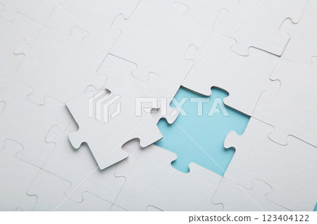The last piece of jigsaw puzzle to complete the mission on blue background 123404122