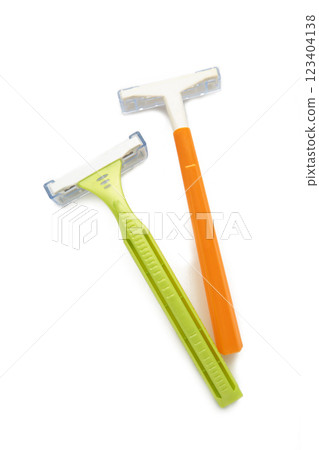 Green and orange woman razor isolated on a white background. Green and orange woman razor isolated on a white background. 123404138