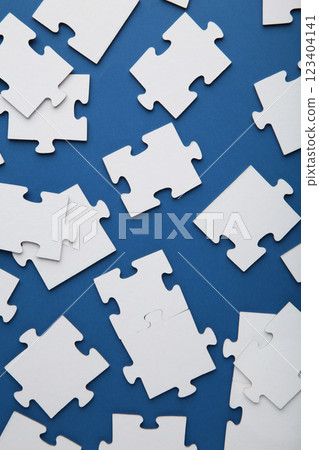 Uncompleted elements of a white puzzle on blue background. Uncompleted elements of a white puzzle on blue background. 123404141