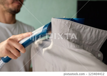 Steam cleaning your garments ensures a crisp, polished finish that enhances their appearance Steam cleaning your garments ensures a crisp, polished finish that enhances their appearance 123404412