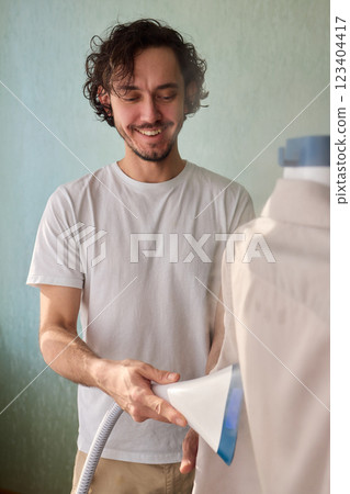 Steam cleaning your garments ensures a crisp, polished finish that enhances their appearance 123404417