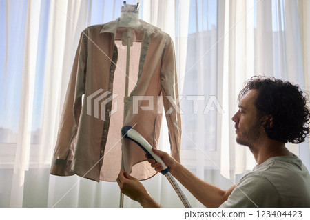 Steam cleaning your garments ensures a crisp, polished finish that enhances their appearance Steam cleaning your garments ensures a crisp, polished finish that enhances their appearance 123404423